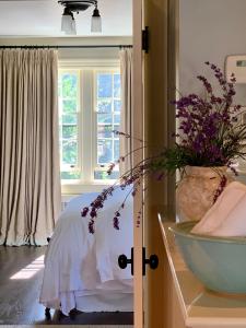 a bedroom with a bed and a window at The Pebble Bed and Breakfast in Halifax