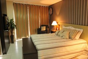 A bed or beds in a room at Betel Beach Flat Boa Viagem