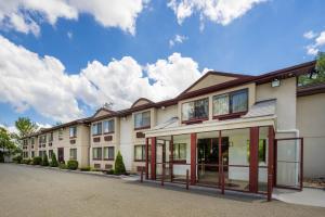 a row of apartment buildings with a sky background at FairBridge Inn Express Nyack in Nyack