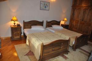Voodi või voodid majutusasutuse Hotel Samarkand Safar toas