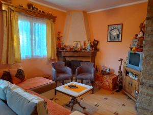 a living room with a couch and a fireplace at Kuća - vikendica in Kotor