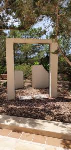 A garden outside Viviendas Ferrer-Es Mal Pas