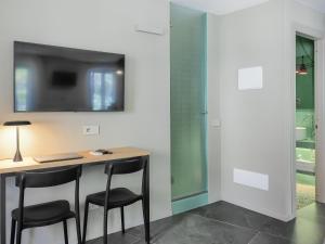TV o dispositivi per l'intrattenimento presso Dreamers Sea View