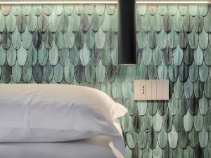 Letto o letti in una camera di Dreamers Sea View
