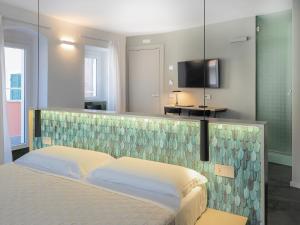 Letto o letti in una camera di Dreamers Sea View