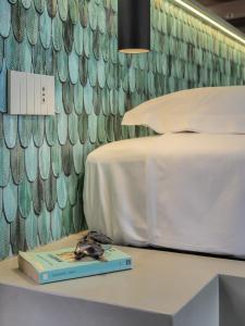 Letto o letti in una camera di Dreamers Sea View