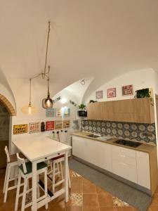 a kitchen with a table and a counter top at Holiday Home Falchetta in Palena