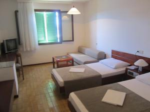 Postel nebo postele na pokoji v ubytování Hotel Zenit Neum