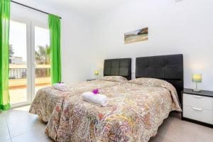 Postel nebo postele na pokoji v ubytování Villa Dunas in Cala Dor