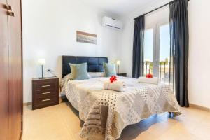 Postel nebo postele na pokoji v ubytování Villa Dunas in Cala Dor