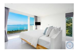 TV a/nebo společenská místnost v ubytování Panorama Samui Residences