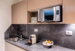 Η κουζίνα ή μικρή κουζίνα στο Forte16 View & SPA