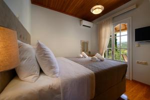 Posteľ alebo postele v izbe v ubytovaní Grand Villa Roubana + 37 fotografií