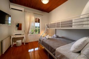 Posteľ alebo postele v izbe v ubytovaní Grand Villa Roubana