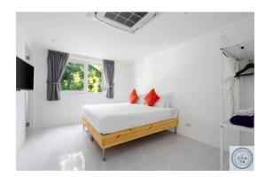 Postel nebo postele na pokoji v ubytování Panorama Samui Residences