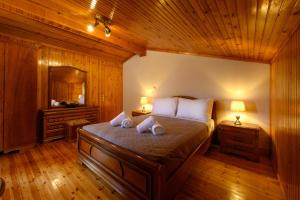 Posteľ alebo postele v izbe v ubytovaní Grand Villa Roubana