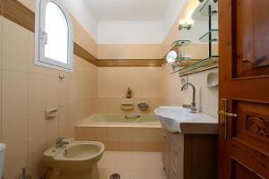 Kúpeľňa v ubytovaní Grand Villa Roubana