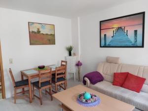 a living room with a couch and a table at Ferienwohnung Rickyy in Reichenbach im Vogtland
