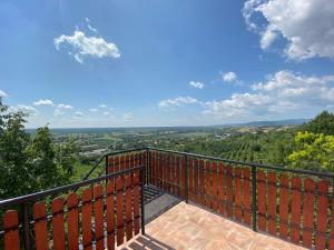 a balcony with a view of the countryside at Fehér Szőlő Vendégház in Sátoraljaújhely