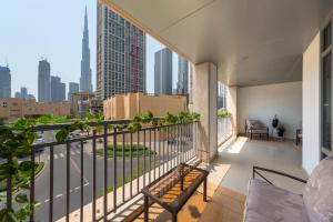 a balcony with a view of a city at One Bedroom in Burj Views by Radiance Vacation Stays in Dubai