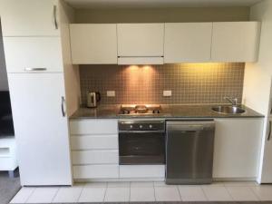 
A kitchen or kitchenette at Beachside Luxury Apartments One & Two Bedroom
