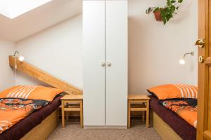 Postel nebo postele na pokoji v ubytování Apartmány Pod Lesem