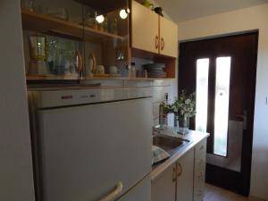 a kitchen with a sink and a dishwasher at Apartment Tomato in Pula