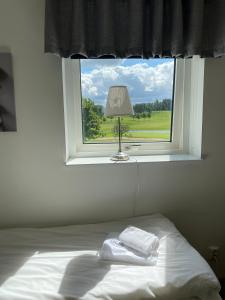 Postel nebo postele na pokoji v ubytování Halmstad Tönnersjö Golfbana