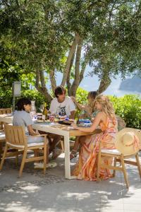 a group of people sitting at a table at Villa Arabella in Capri