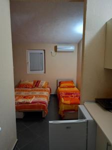 Postel nebo postele na pokoji v ubytování MD Apartmani Canj