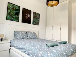 a bedroom with a bed with two pillows on it at Apartamenty Wrzeszcz by Q4Apartments in Gdańsk