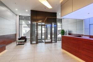 an office lobby with a reception desk and a chair at KIGO Liner mini-hotel in Moscow