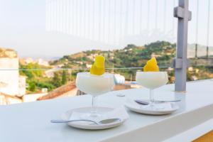 two wine glasses with ice cream on a table at La Dimora Di Segesta B&B in Calatafimi