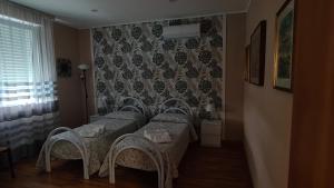 Postel nebo postele na pokoji v ubytování B&B Regina