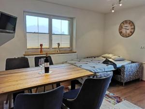 A bed or beds in a room at Pension Tannheim