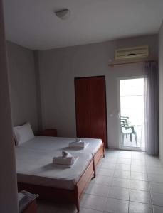 Postel nebo postele na pokoji v ubytování GR Apartments Sea View