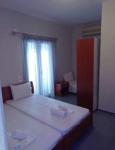 Postel nebo postele na pokoji v ubytování GR Apartments Sea View
