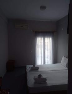 Postel nebo postele na pokoji v ubytování GR Apartments Sea View