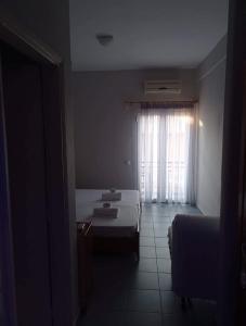 Postel nebo postele na pokoji v ubytování GR Apartments Sea View