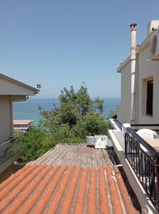 a view of the ocean from the roof of a house at GR Apartments Sea View in Kallithea Halkidikis