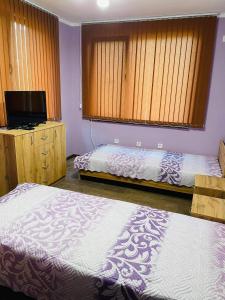 Katil atau katil-katil dalam bilik di Къща за гости Станеви