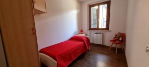 Postelja oz. postelje v sobi nastanitve Butterfly Apartment near Monteriggioni