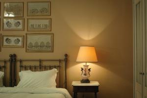 Ένα ή περισσότερα κρεβάτια σε δωμάτιο στο Albergo Hotel