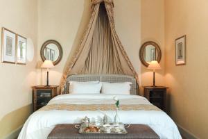 a bedroom with a bed with a tray of food on it at Albergo Hotel in Beirut