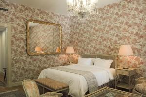 Ένα ή περισσότερα κρεβάτια σε δωμάτιο στο Albergo Hotel