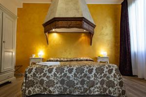 Łóżko lub łóżka w pokoju w obiekcie Locanda Casa Martini