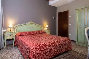 Łóżko lub łóżka w pokoju w obiekcie Locanda Casa Martini