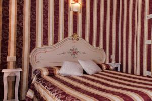 Łóżko lub łóżka w pokoju w obiekcie Locanda Casa Martini