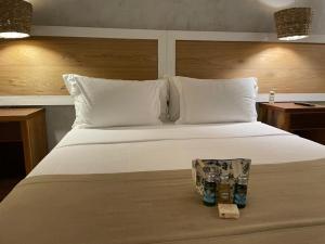 Cama ou camas em um quarto em Hiu Hotel