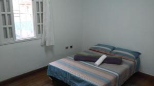 Cama o camas de una habitación en Casa Paulista